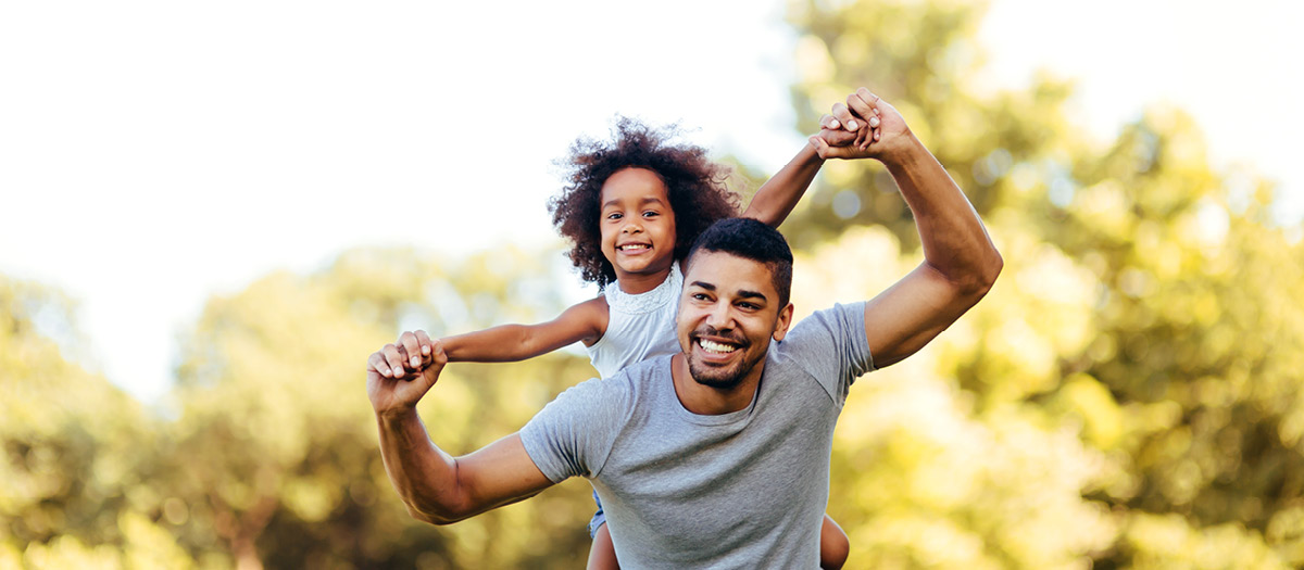 man and daughter smiling